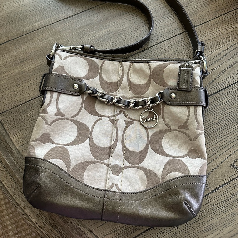 This Coach bag has never been carried.